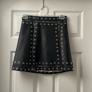 Alice + Olivia Black Faux Leather Mini Skirt with Silver Eyelet Trim